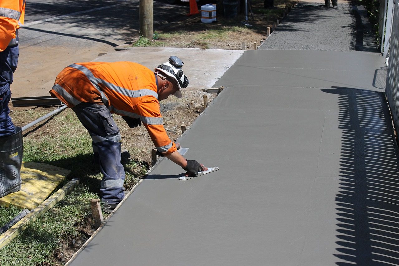 Newly constructed concrete sidewalk installation by Titans Concrete Inc.